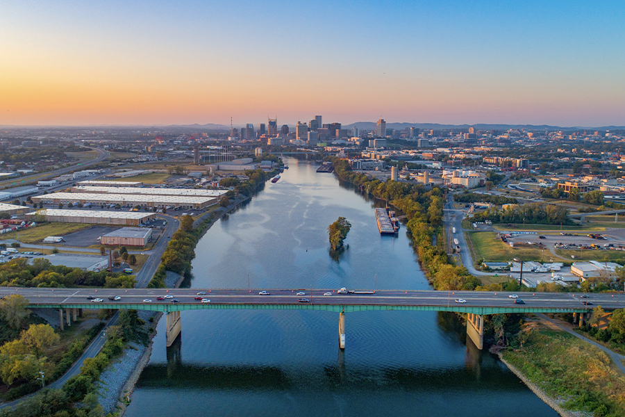 Contact - Aerial View of Nashville Tennessee Skyline, Cumberland River and Surrounding Area